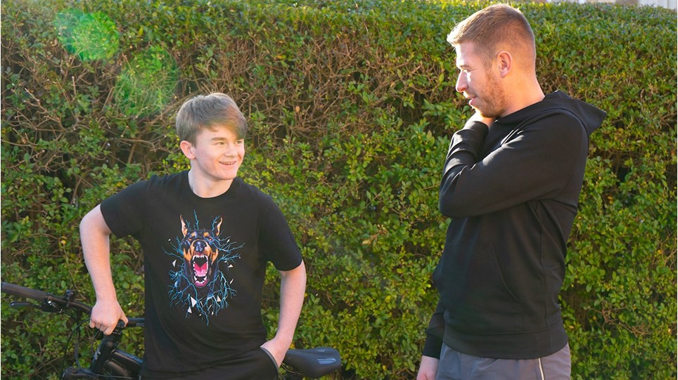 young boy being mentored by adult