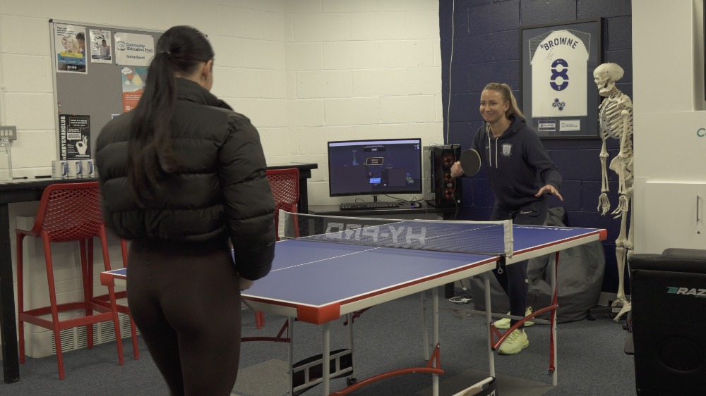 playing a game of table tennis